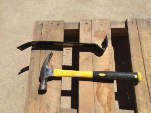 Basic tools needed for taking a wooden pallet apart.