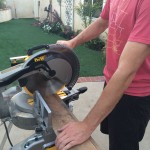 Cutting boards to length using a compound miter saw